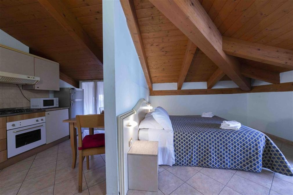 Residenza Melucci Aparthotel Rimini Bilik gambar